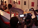 Brunette takes facial at Euro sex expo 