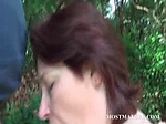 Naked mommy blows hard pecker outdoor 
