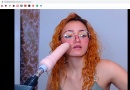 curly babe is mouthing the fuck machine 